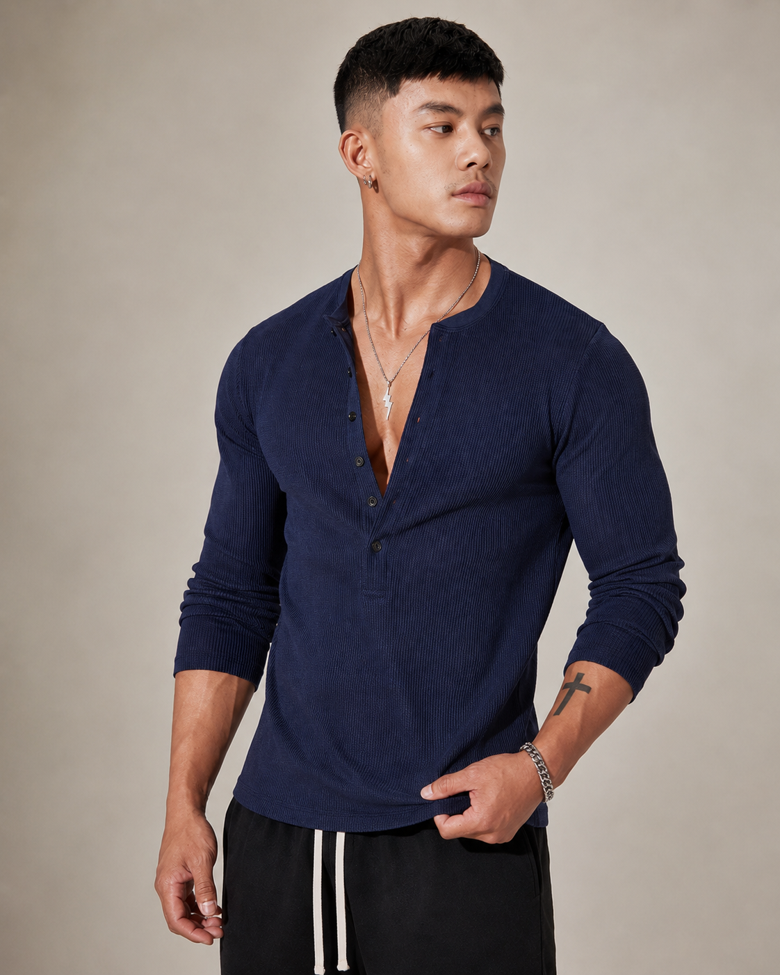 Back view of the men's sweater highlighting its textured knit design