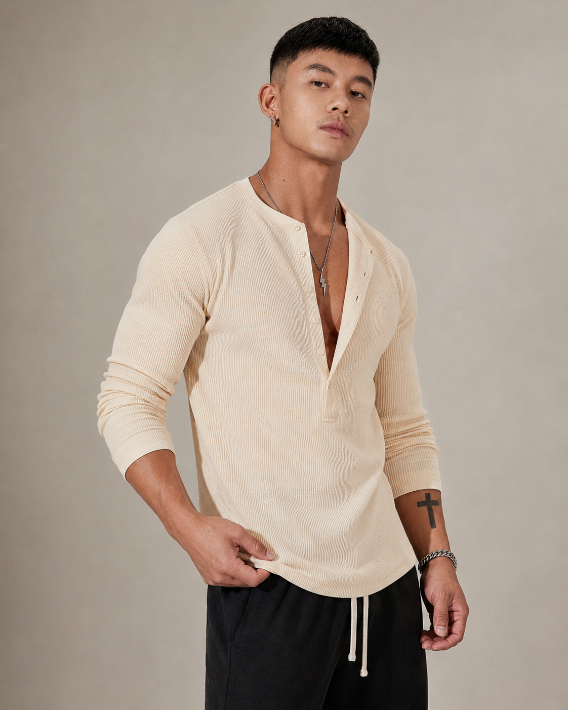 Close-up of the ribbed knit texture and half-button neckline