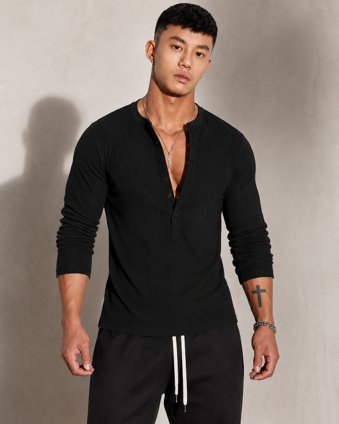 Men's sweater showing the buttoned neckline and long sleeves