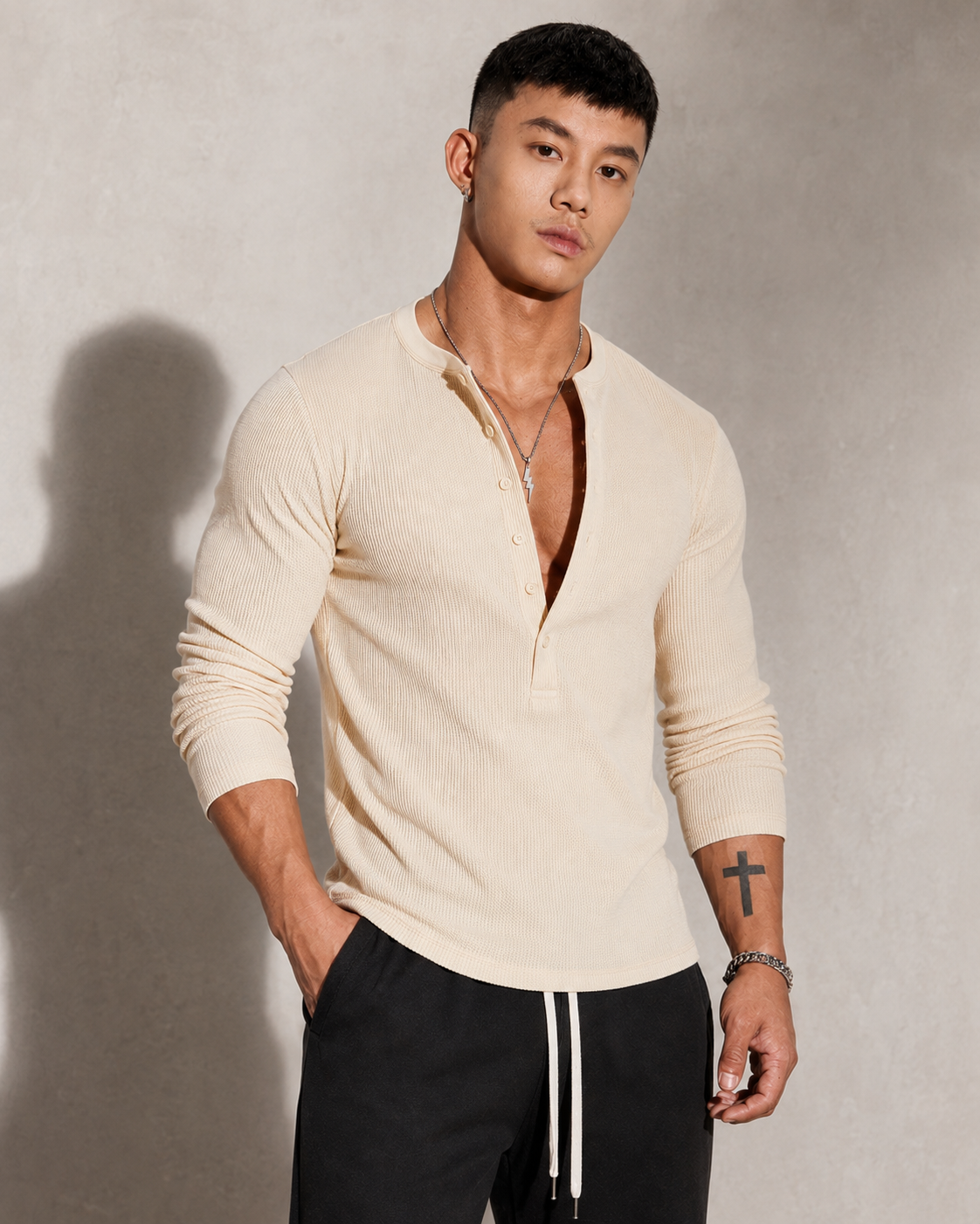 Men's ribbed knit sweater with a half-button neckline shown from the front