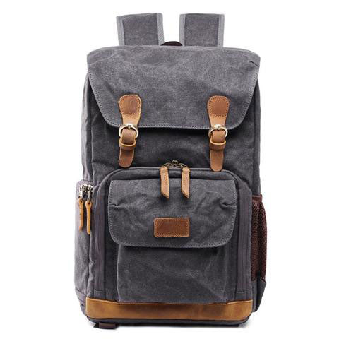 Side view of the vintage camera backpack showing profile and compact daily carry size