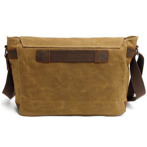 Close-up of vintage crossbody bag material and stitching details