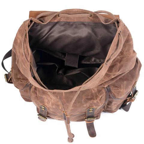Side view of vintage men's backpack highlighting pocket and trim