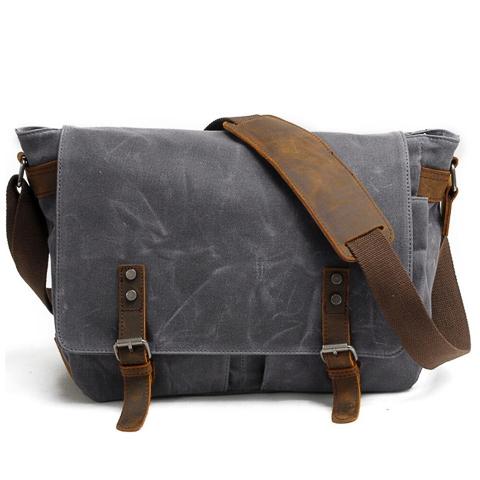 Side view of vintage crossbody bag for men with adjustable strap and structured body
