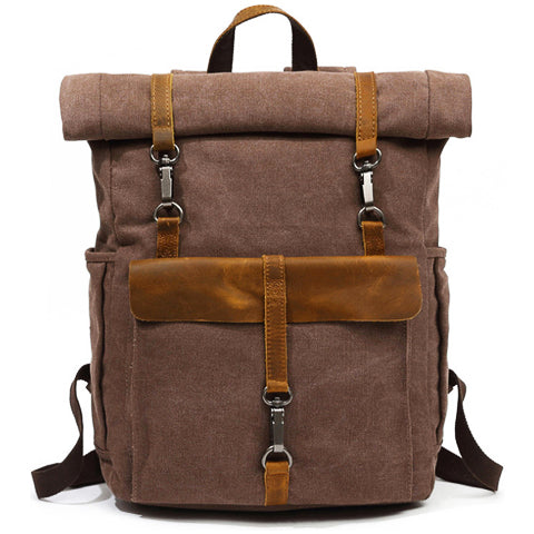 Vintage canvas backpack angled view showing adjustable shoulder straps and structured shape