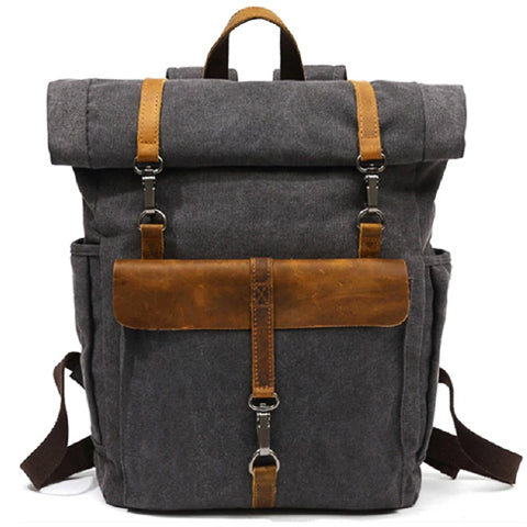 Back view of the canvas backpack with padded adjustable straps and top carry handle