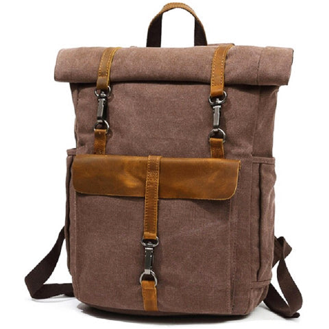 Side view of the vintage canvas backpack highlighting slim profile and pocket details