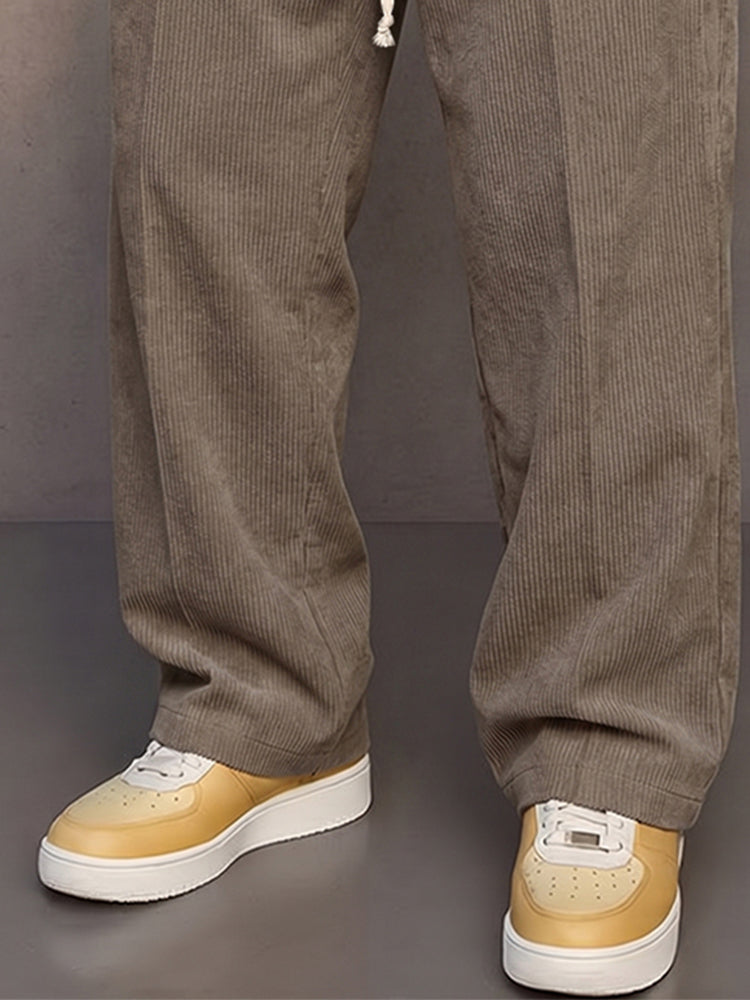 Close-up of the textured corduroy fabric on men's straight-leg pants