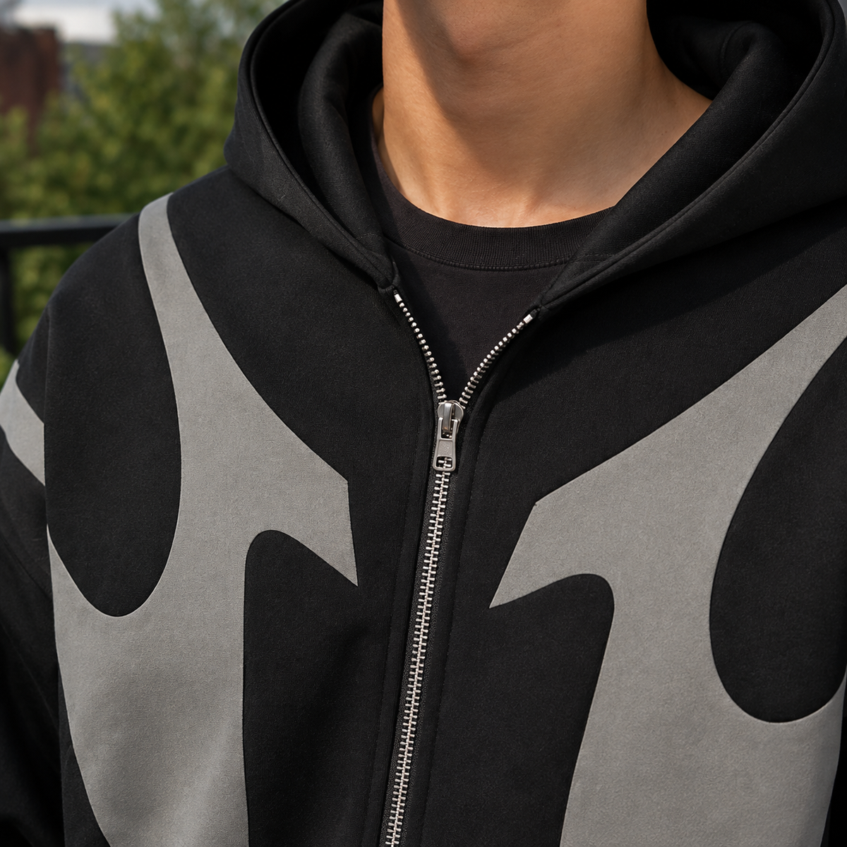 Men's contrast zip hoodie shown from the back with a hood and relaxed fit