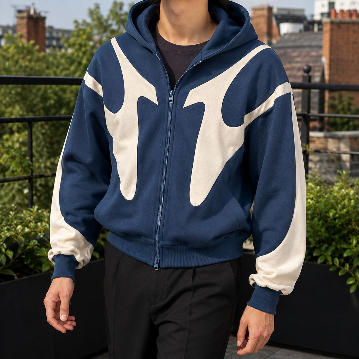 Close-up view of the men's contrast zip hoodie zipper and hood details