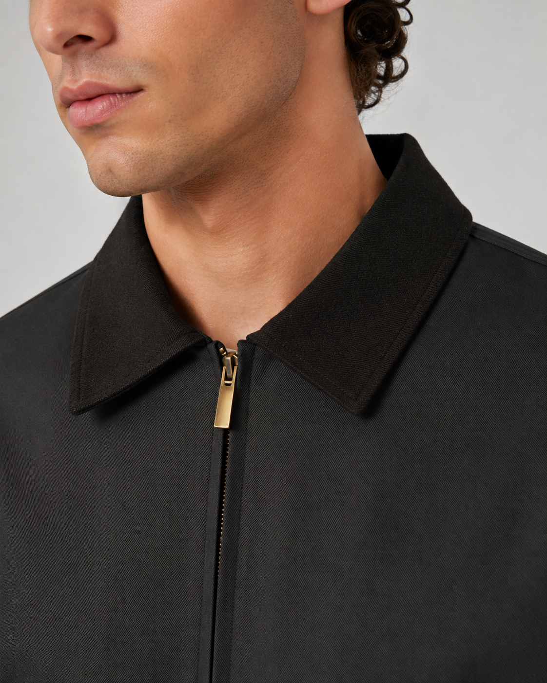 Detail view of the barn jacket's front pockets and zipper