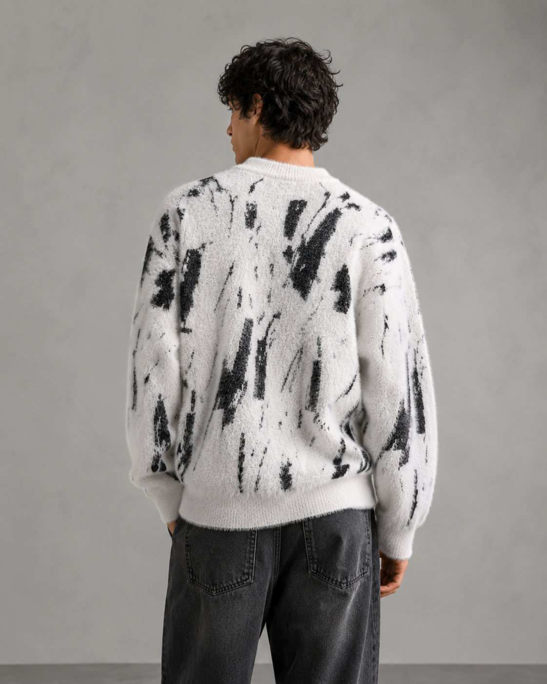 Close-up view of the sweater's fuzzy knit texture
