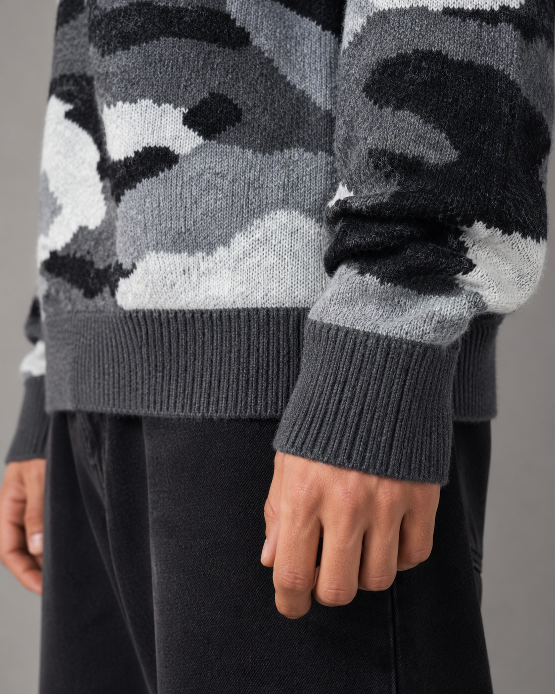 Close-up of the camouflage knit texture on a men's sweater