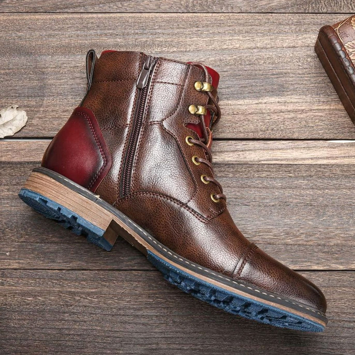 Men's cap-toe leather ankle boots shown from the side with a convenient zipper