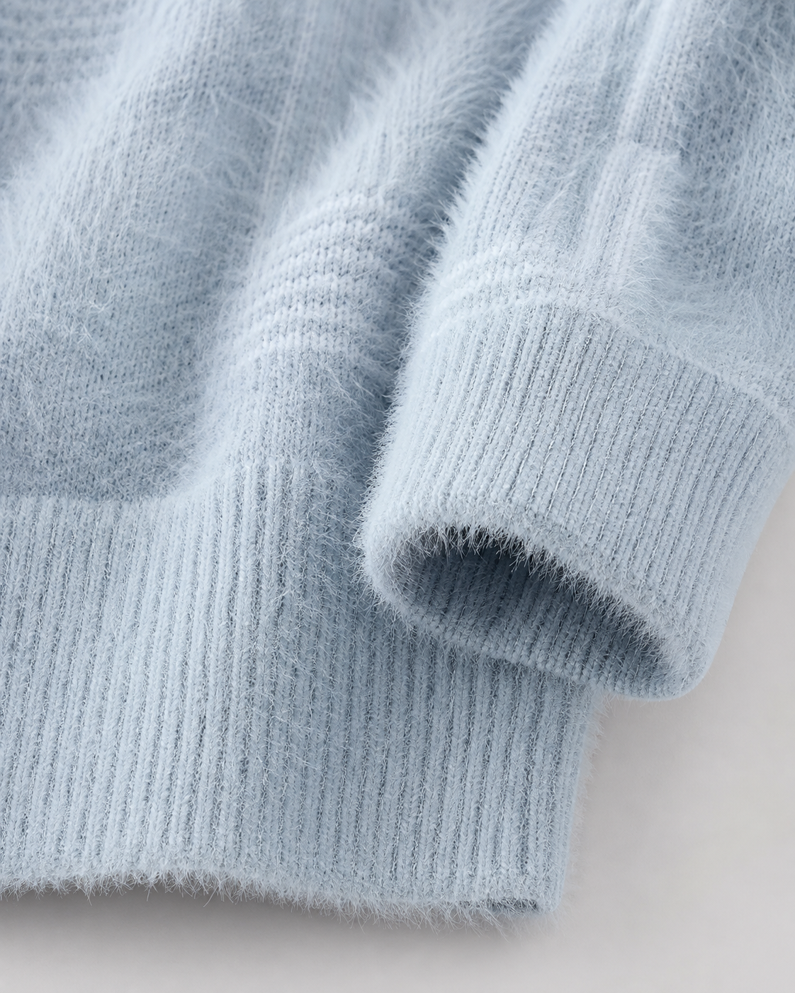 Funnel neck detail on a men's brushed knit sweater