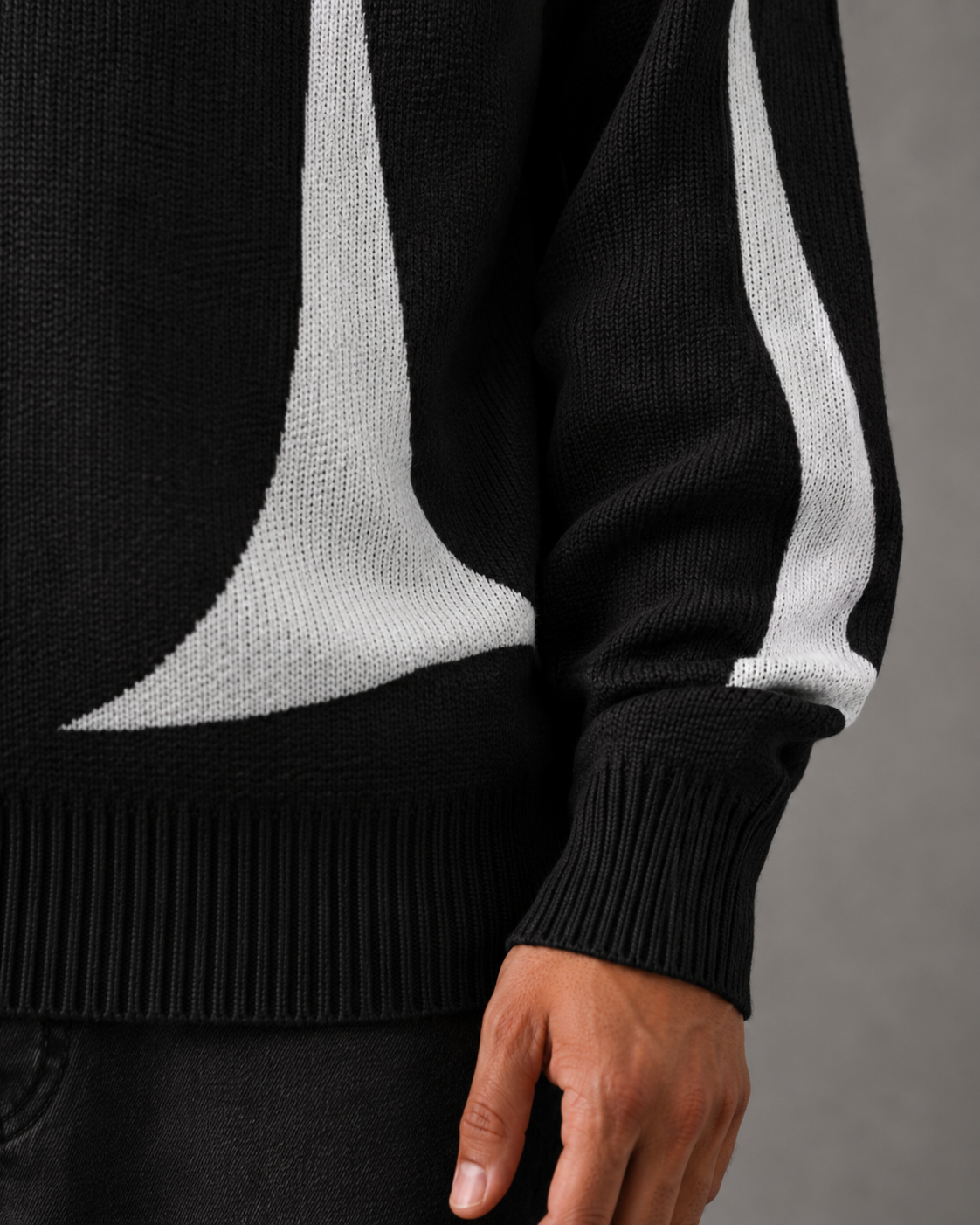 Side view of a relaxed-fit men's graphic knit sweater