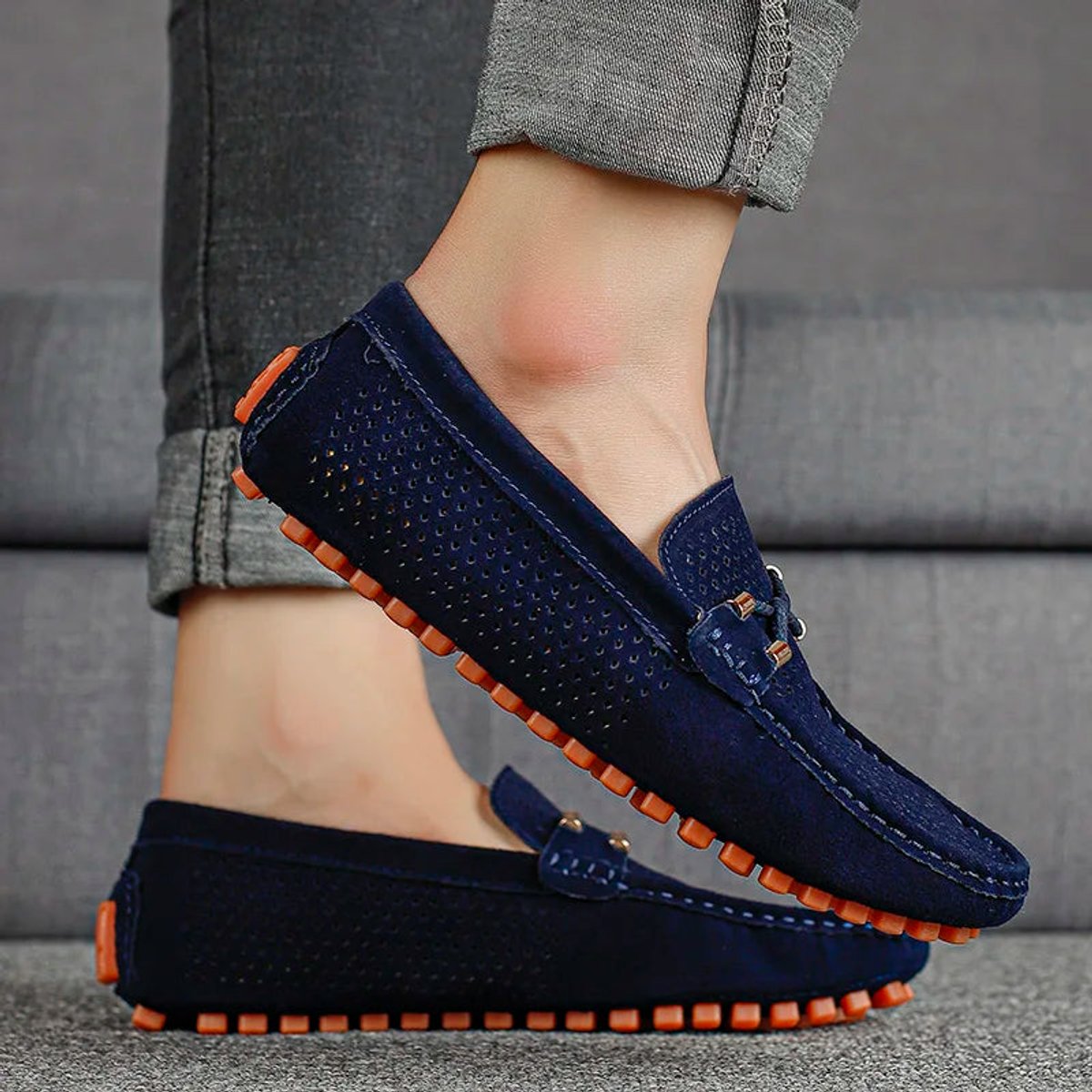 Men's suede driving loafers displayed together at a three-quarter angle