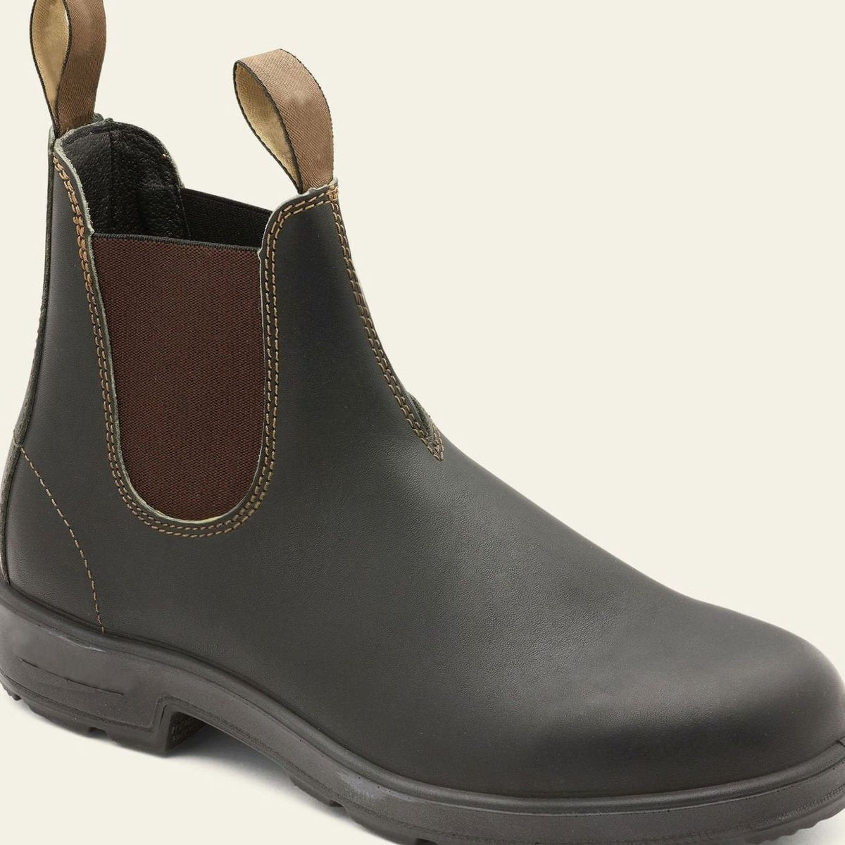 Men's Chelsea boots shown at an angle, highlighting the ankle-height design