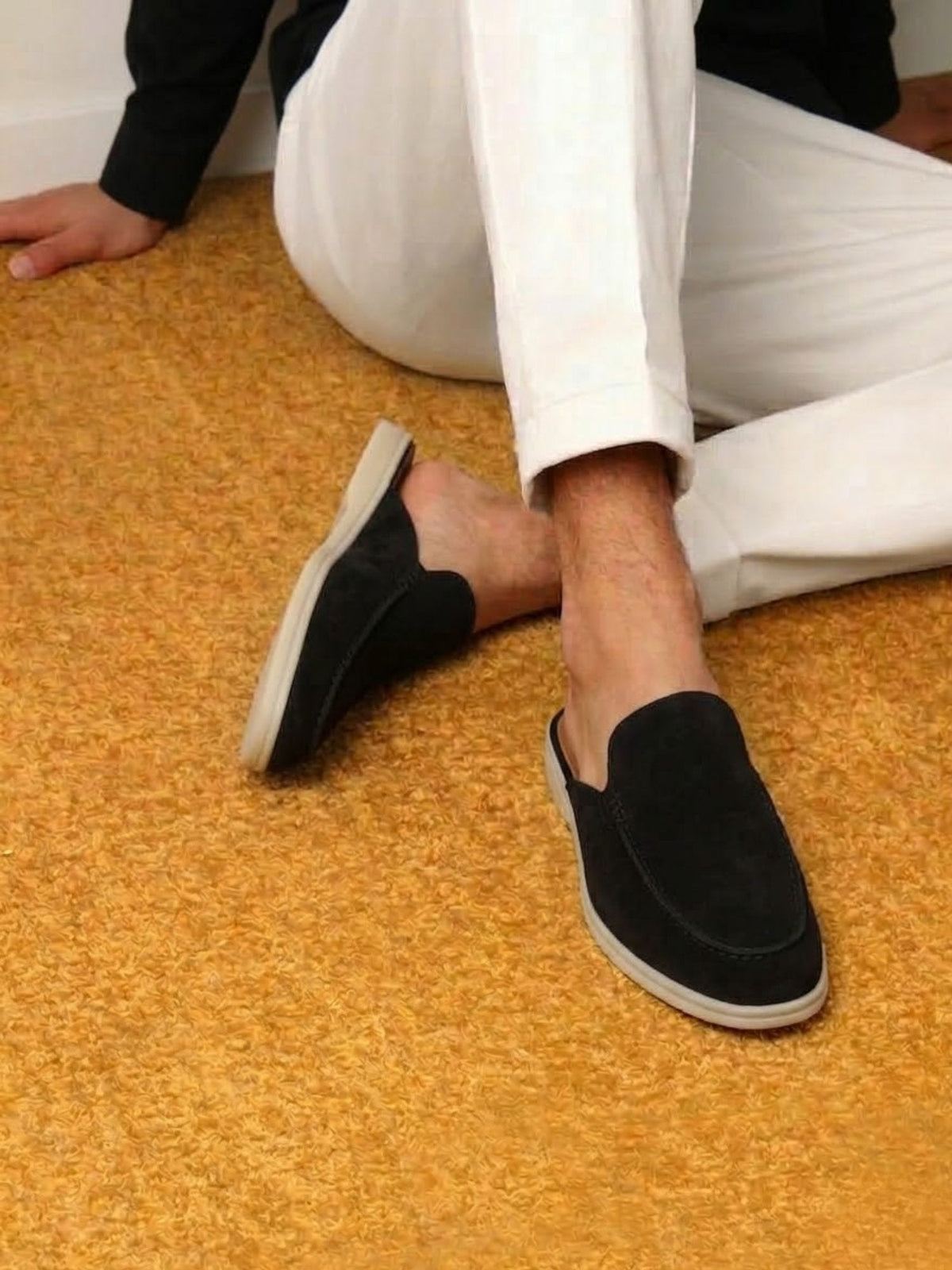 Angled view of men's mules showing the slip-on opening