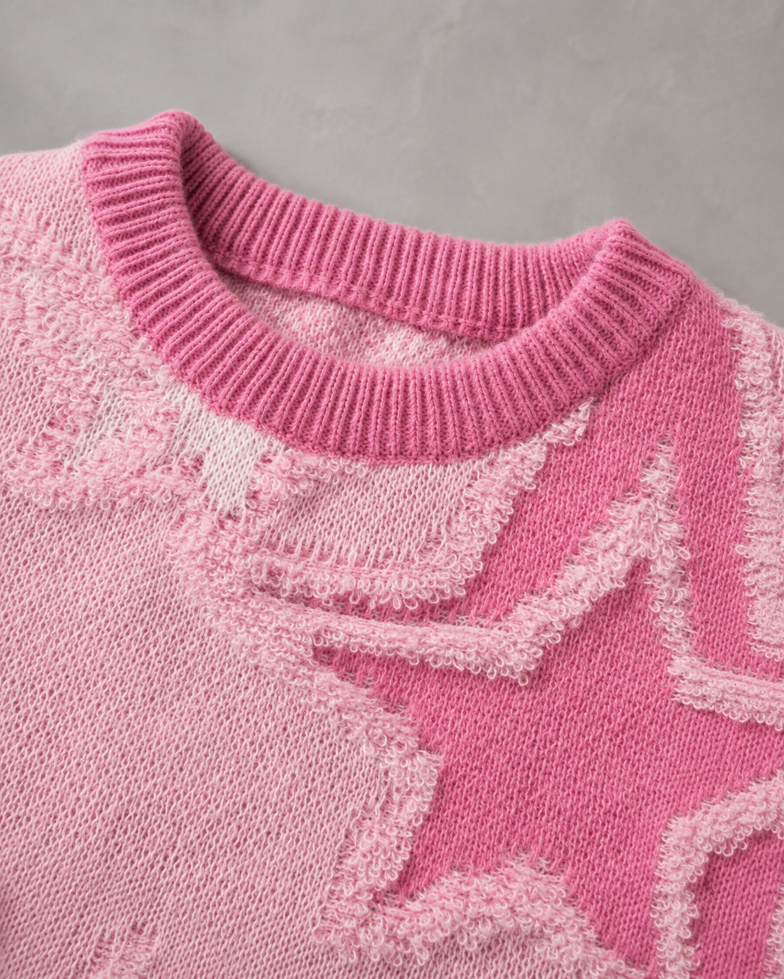 Detail of the knit texture and star motif on the men's sweater