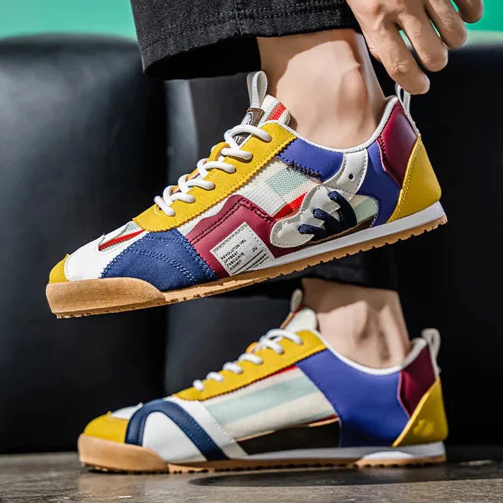 Pair of men's trail sneakers with layered suede mesh uppers