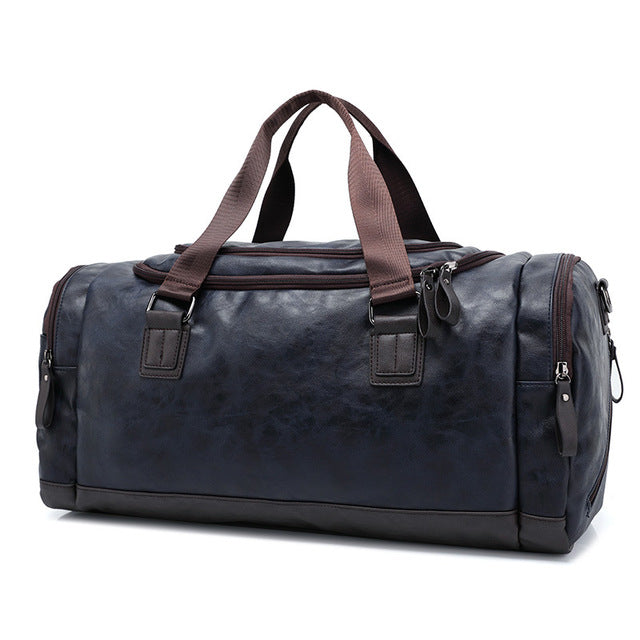 Men's leather travel duffle bag for work and weekend trips in a classic carryall style