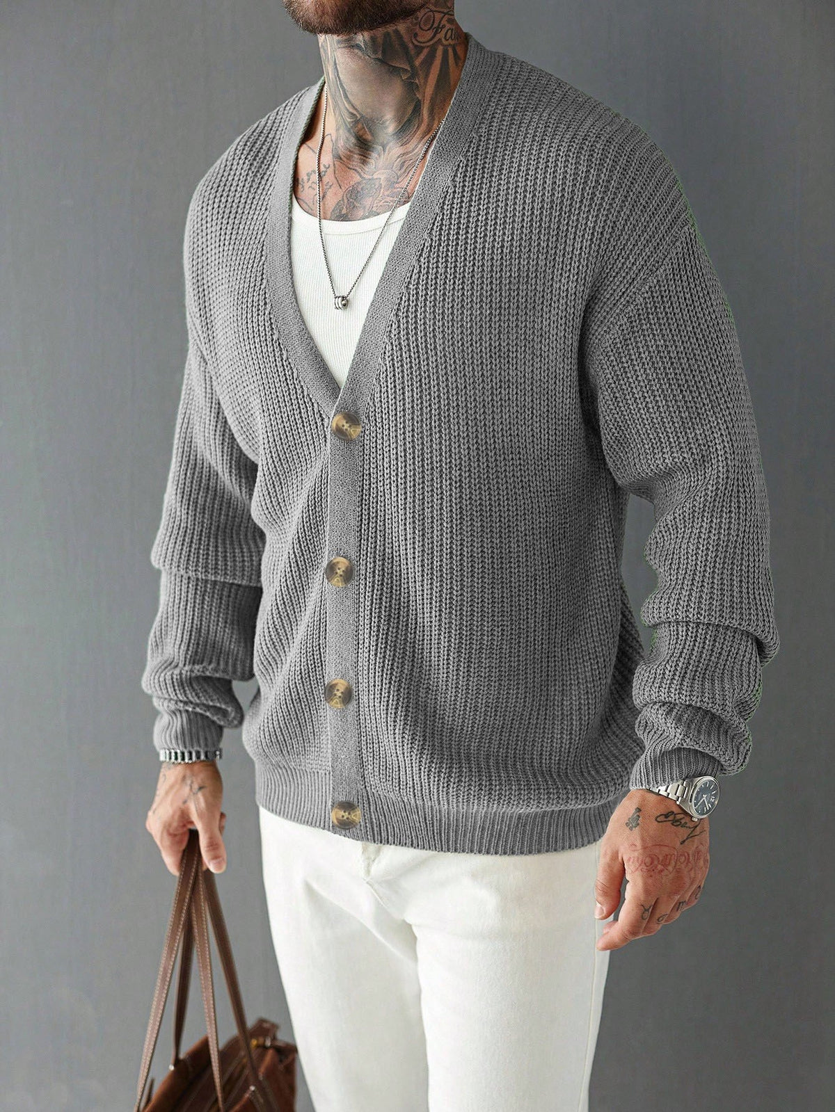 Men's V-neck cardigan sweater styled as a versatile layering piece
