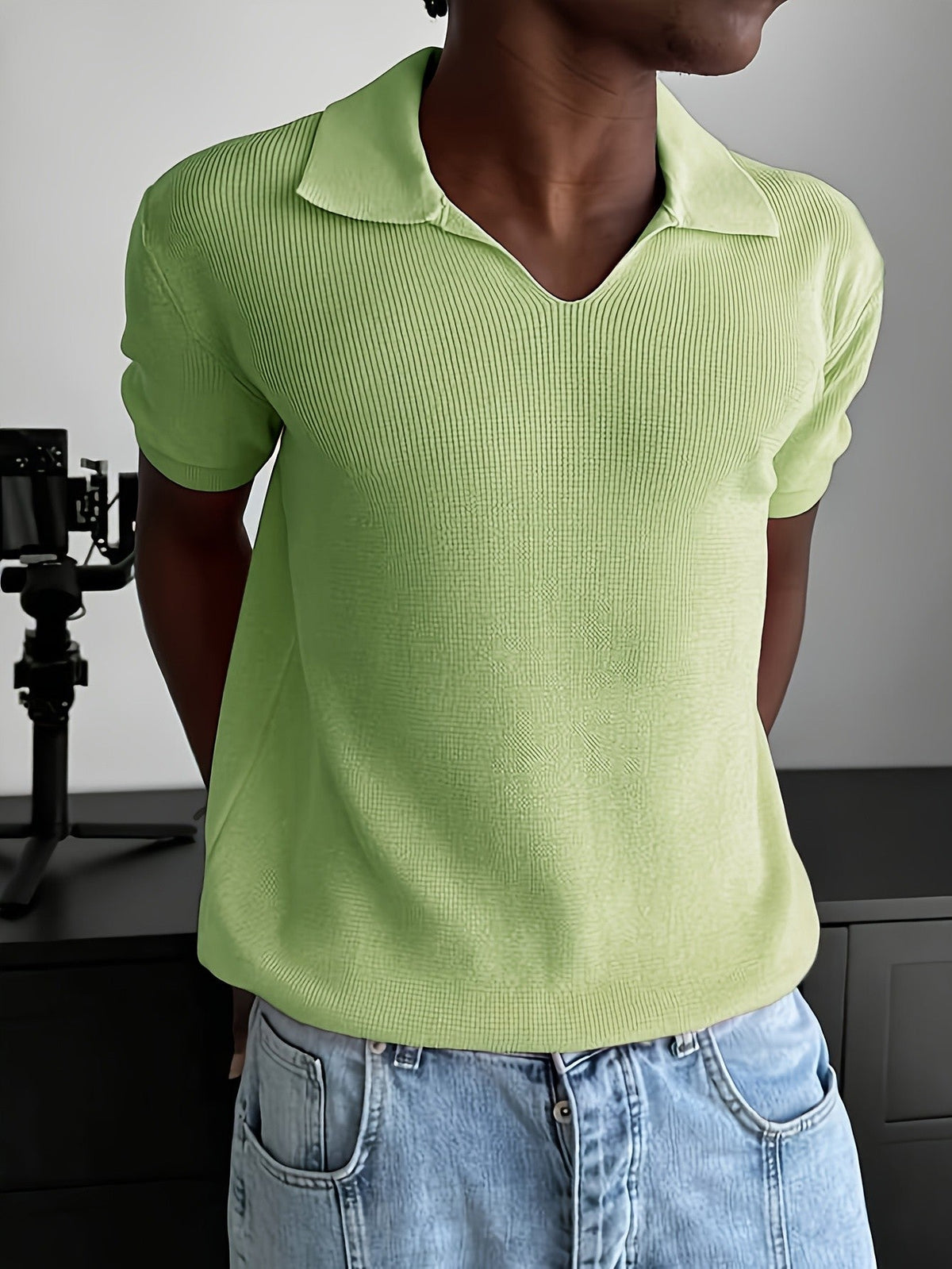 Men's ribbed polo shirt showing the short sleeves