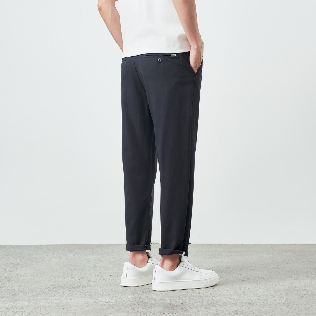 Side view of men's tapered pants in khaki brown