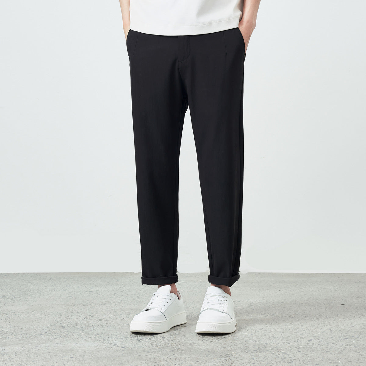 Back view of men's khaki brown tapered pants