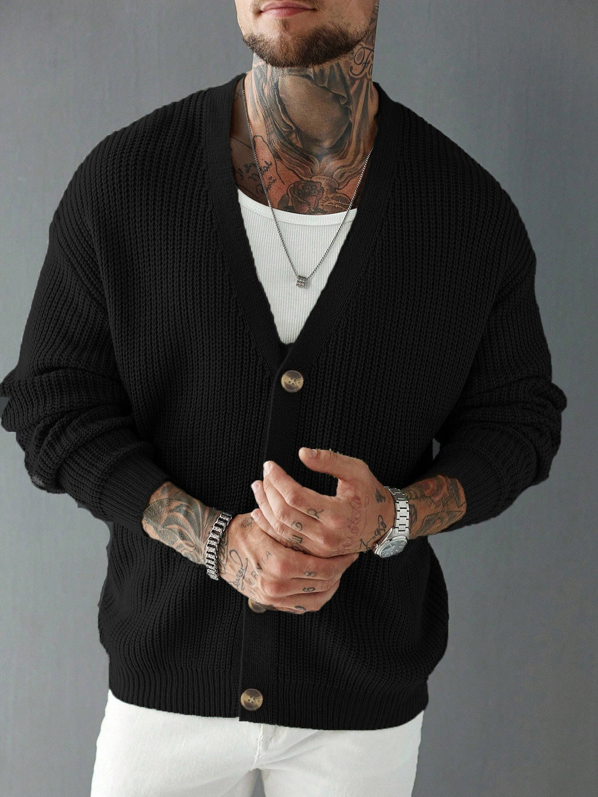 Detail view of the buttons and V-neck on a ribbed men's sweater