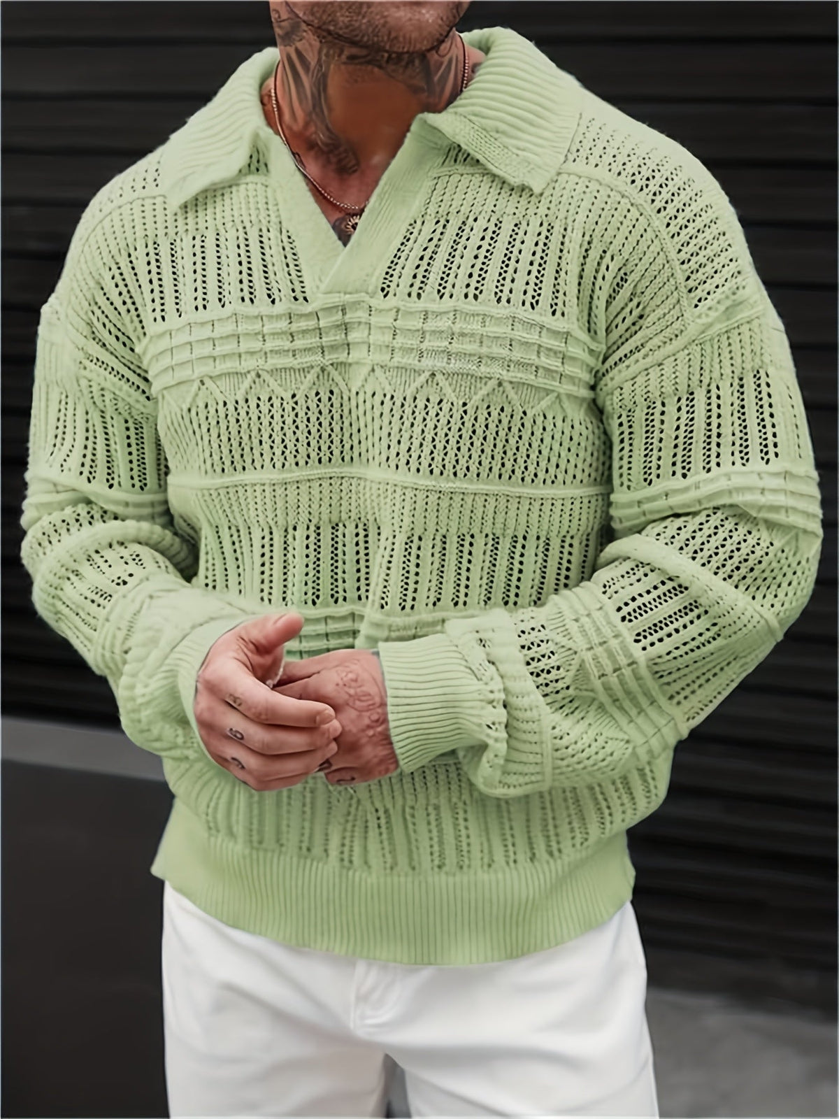Detail view of the cuff on a men's open-knit polo shirt