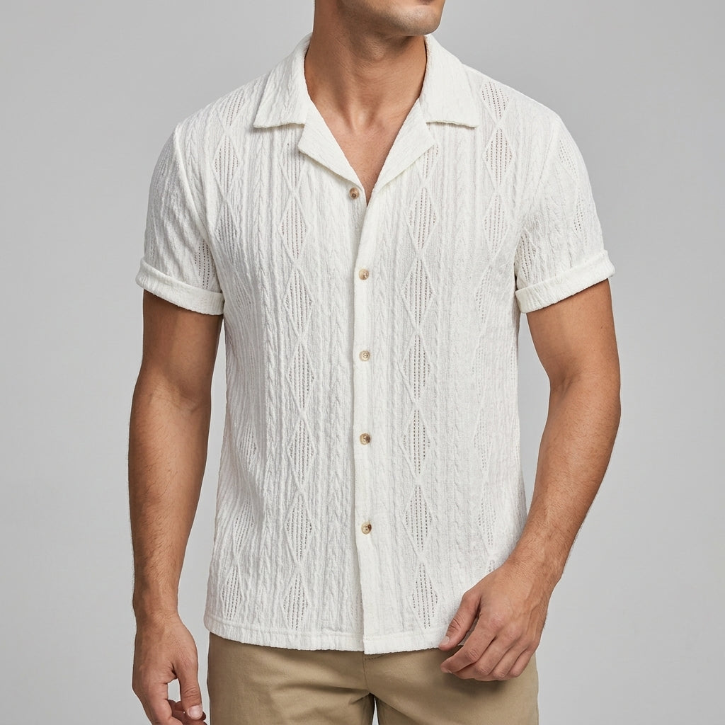 Close-up of the patterned fabric and button closure on a men's shirt
