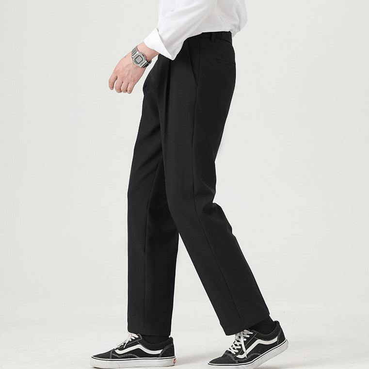 Side view of men's straight-leg dress pants with pressed front pleats