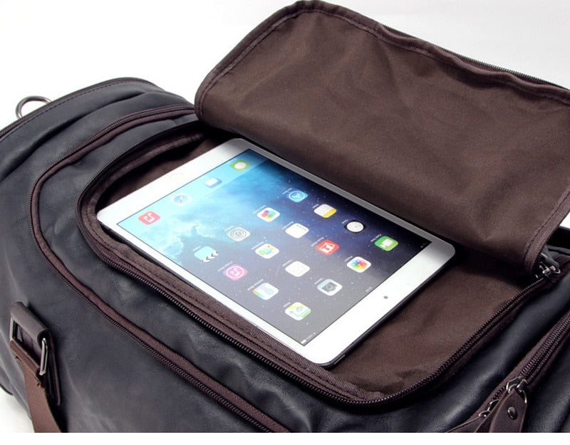Men's leather travel bag styled for business and weekend use with classic brown leather exterior