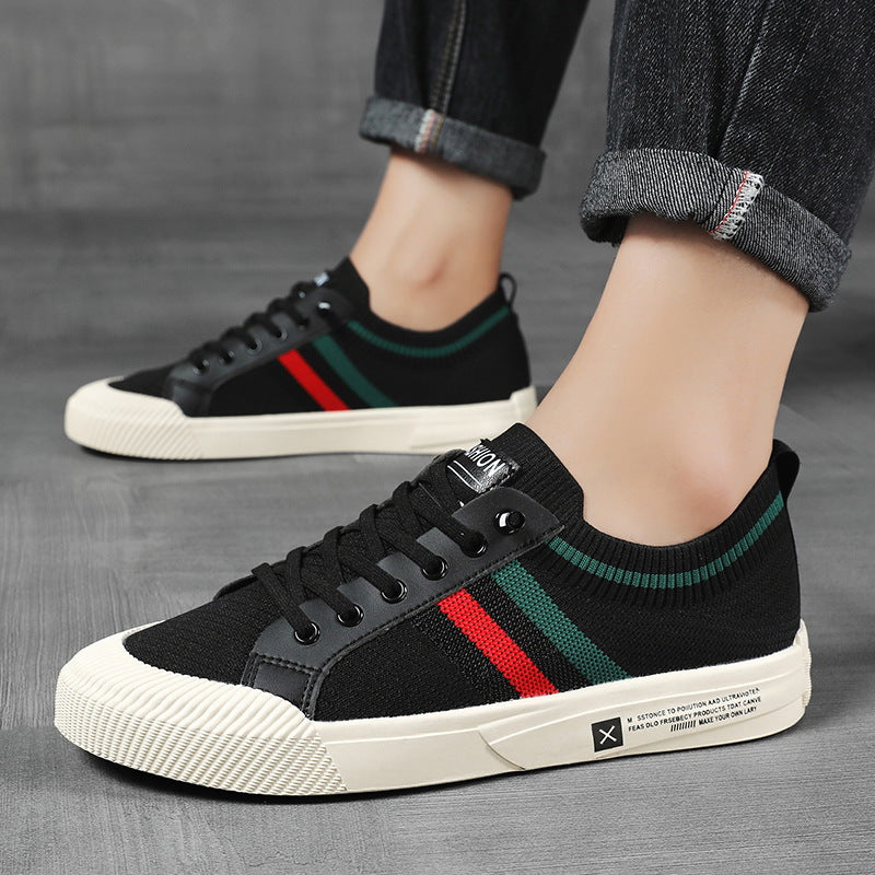 Pair of men's sneakers displaying mesh panels and rubber soles