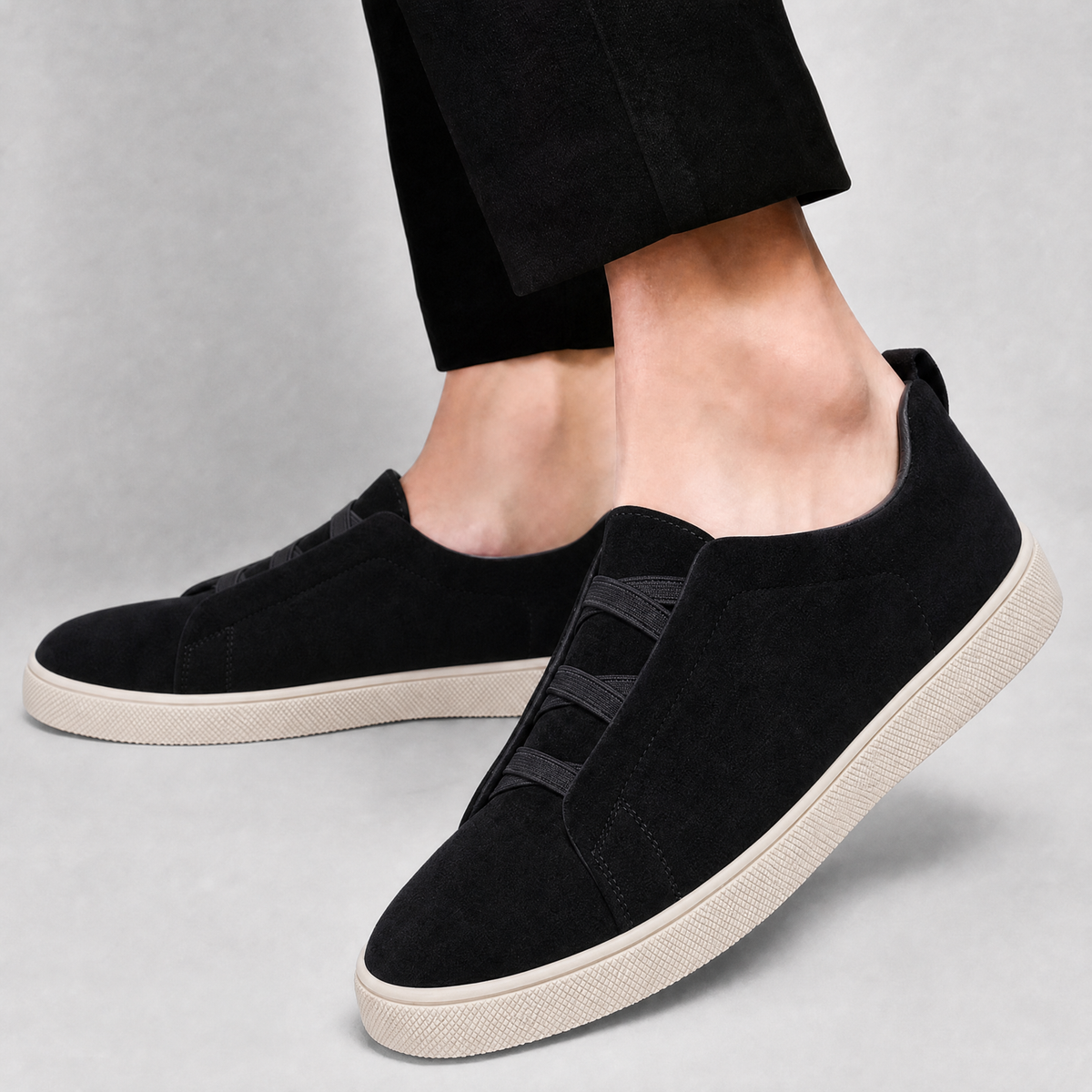 Detail view of the stretch laces and suede finish on a men's sneaker
