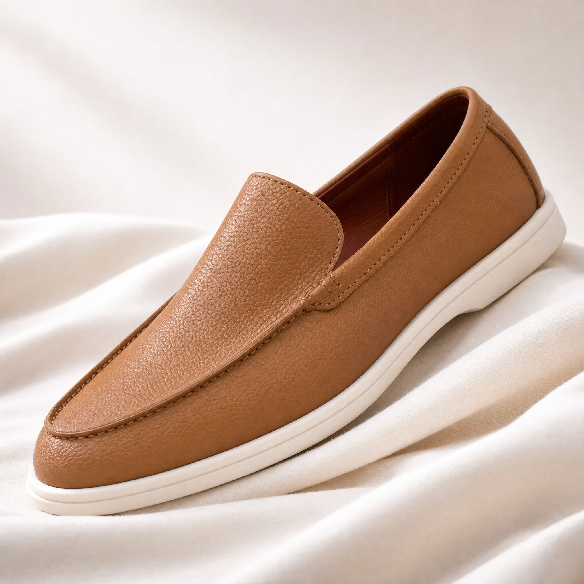 Men's brown leather loafers with a classic slip-on design