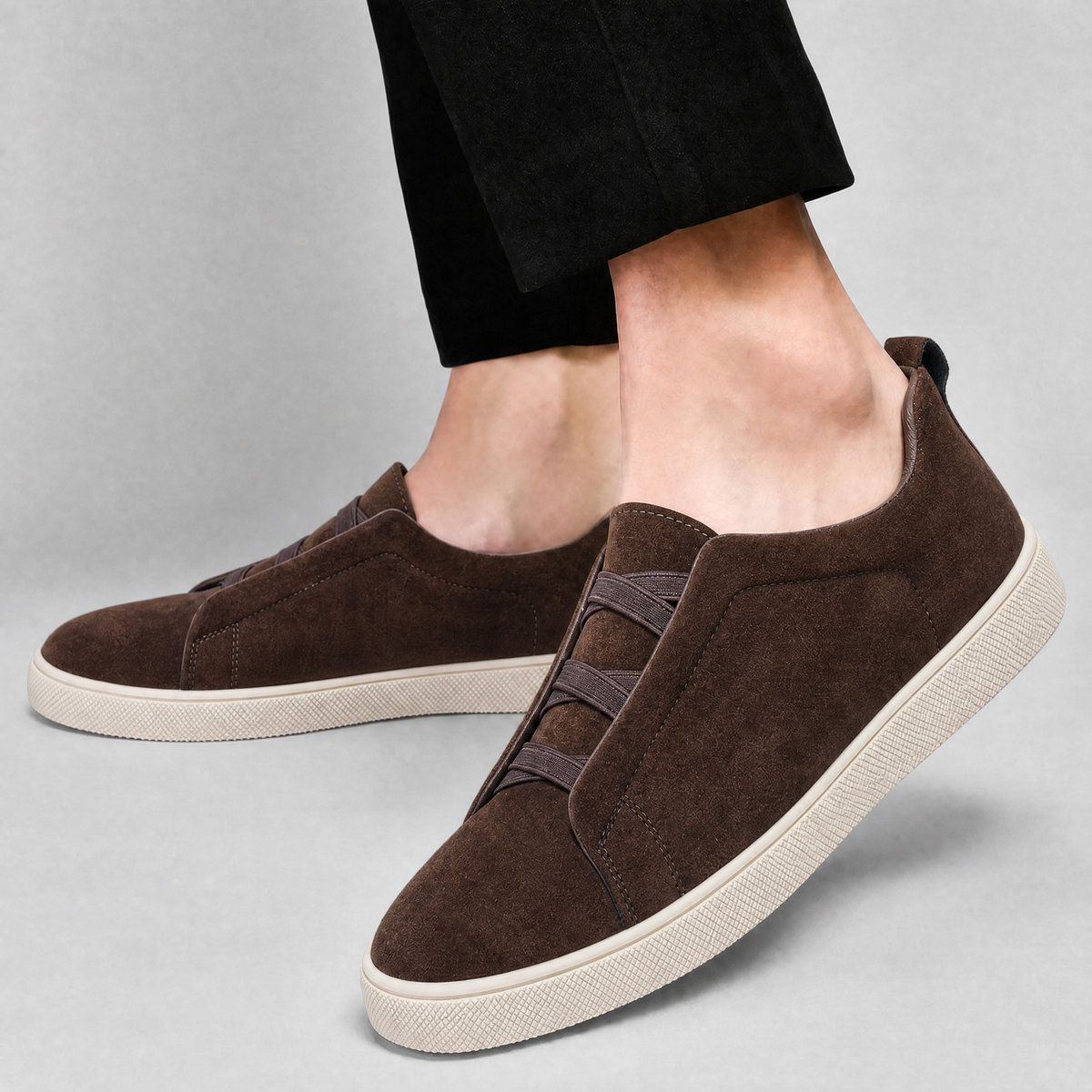 Side profile of a men's suede sneaker with a durable sole