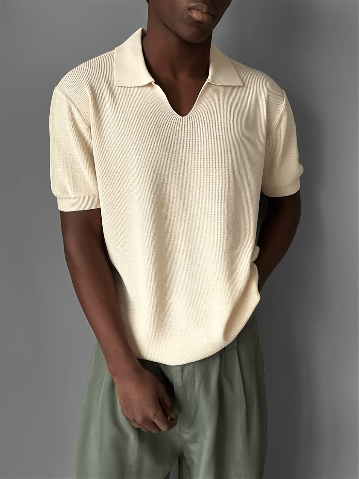 Close-up of the ribbed knit texture on a men's polo shirt