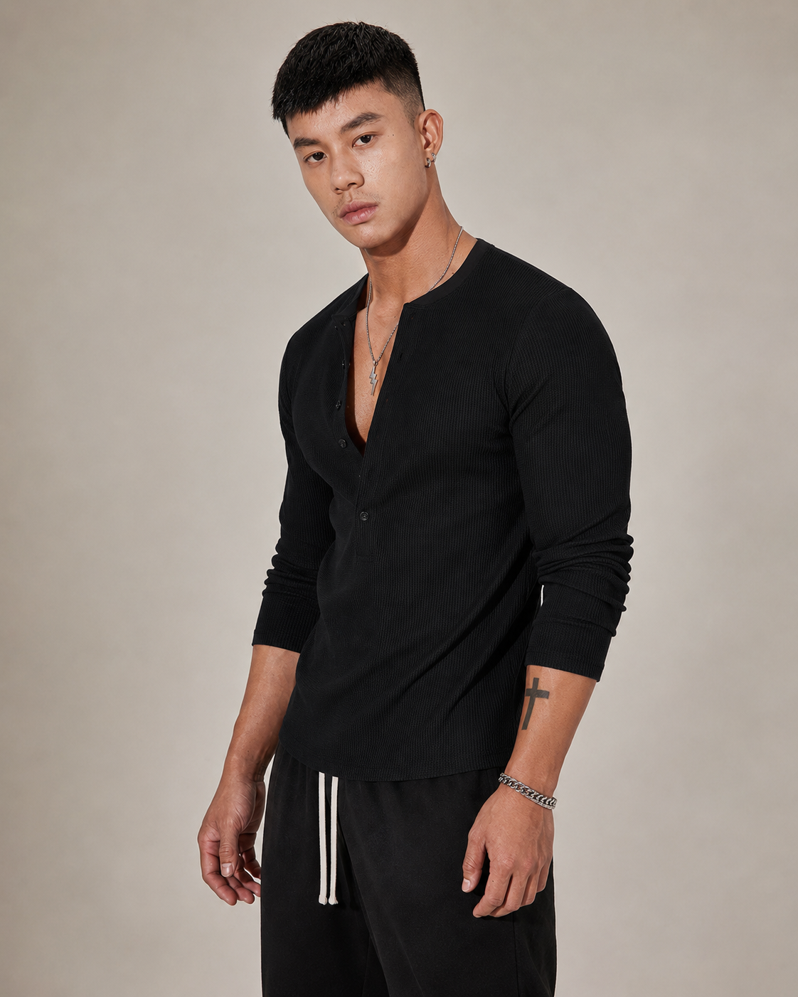 Side view of a men's ribbed knit sweater with a relaxed fit