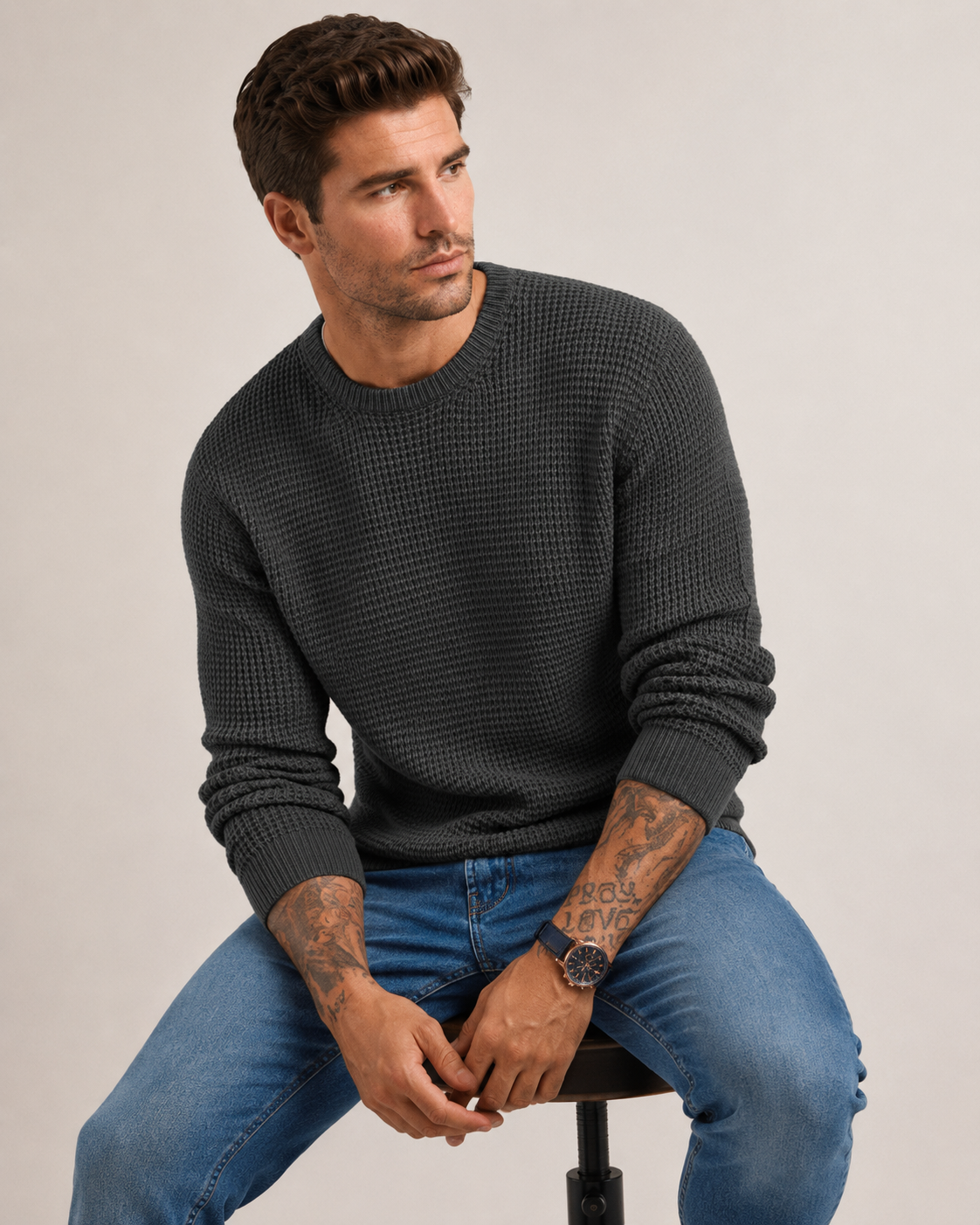 Men's knit sweater styled with tailored trousers