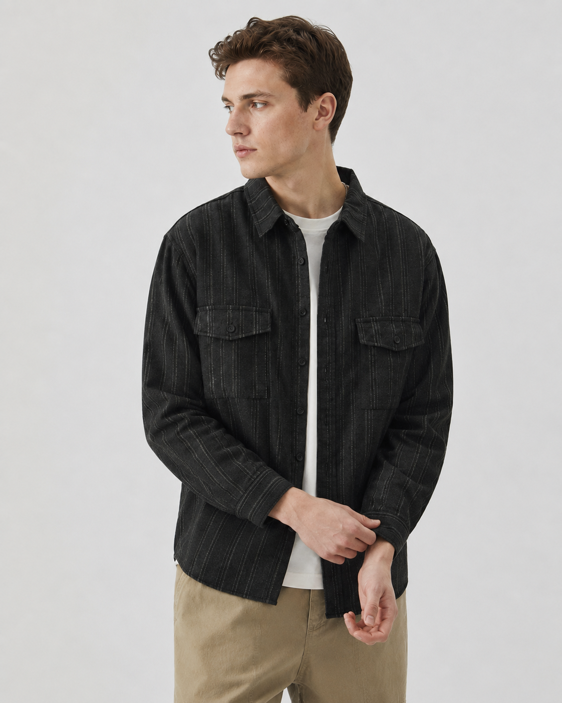 Close-up of the button fastening on the textured overshirt