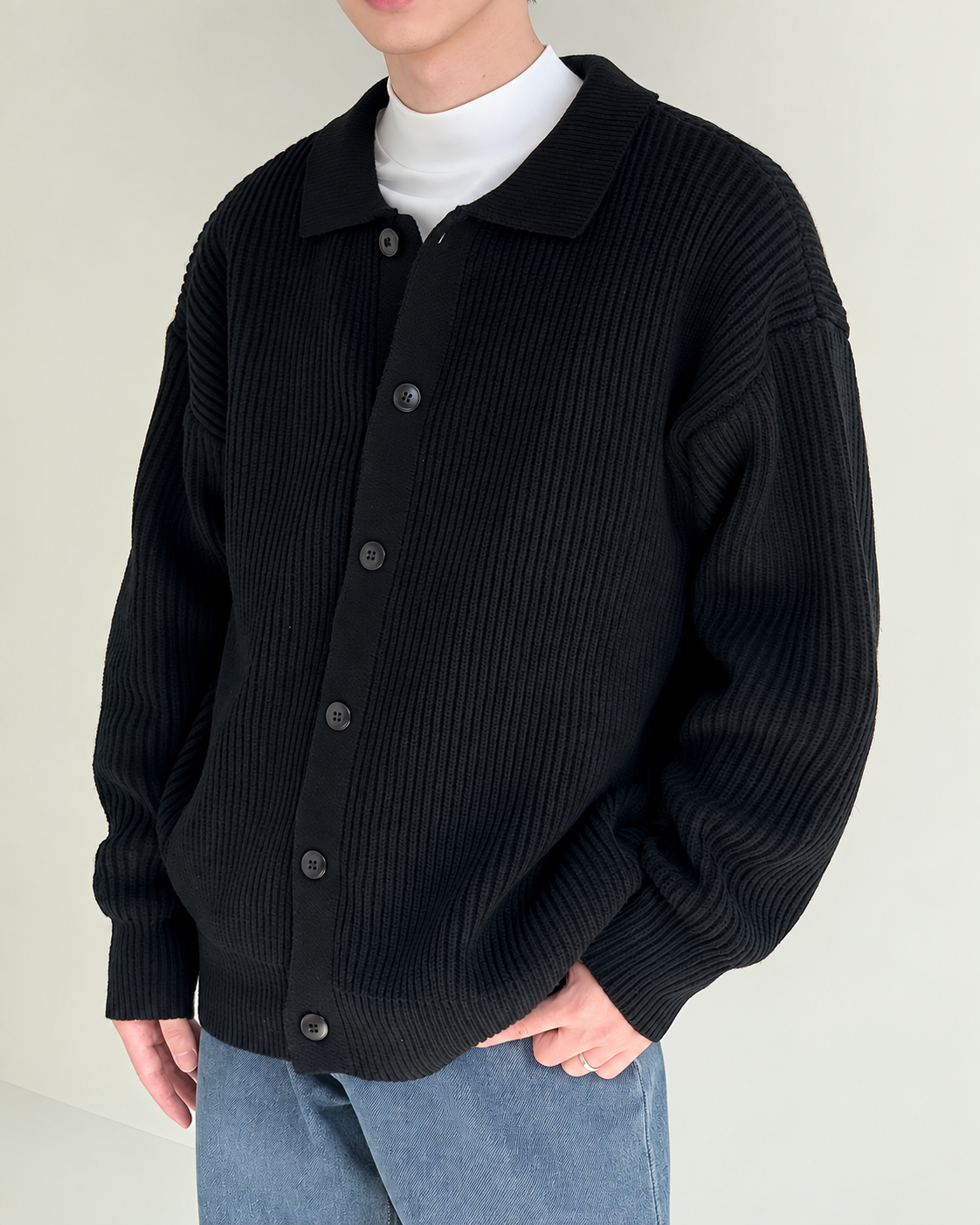 Men's ribbed cardigan shown with its pointed collar detail
