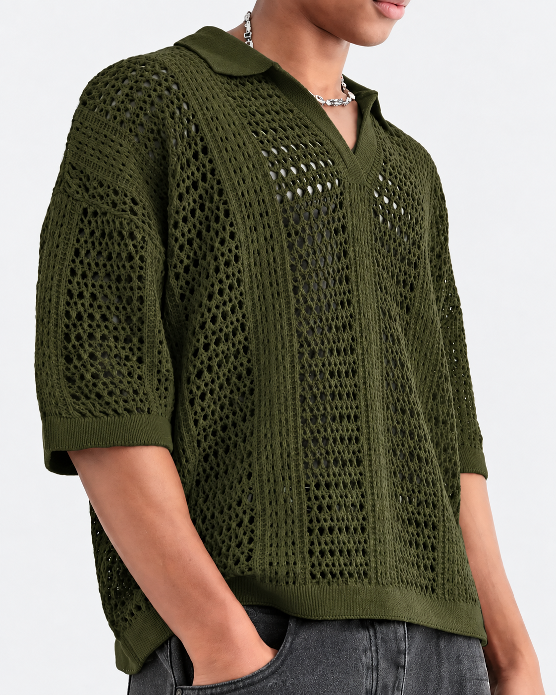 Close-up of the open-knit lattice pattern on a men's polo shirt
