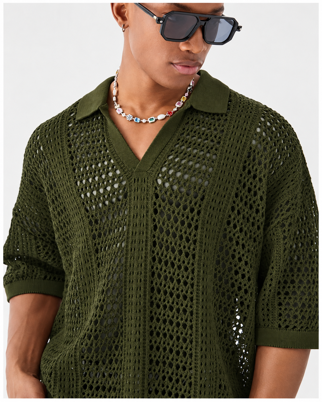 Men's lattice polo shirt displaying its open-knit texture