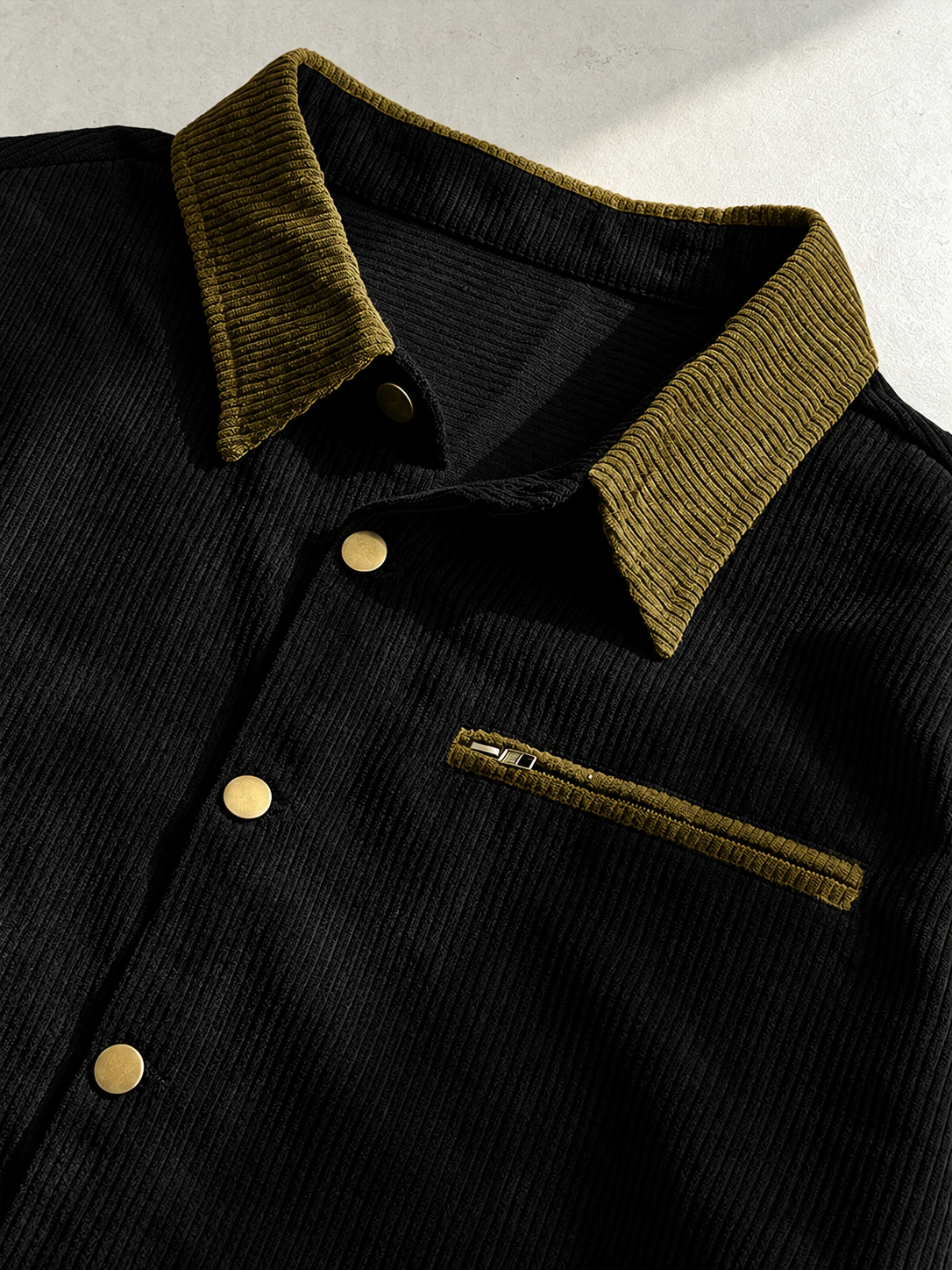 Men's corduroy shirt jacket styled as a versatile everyday layer.