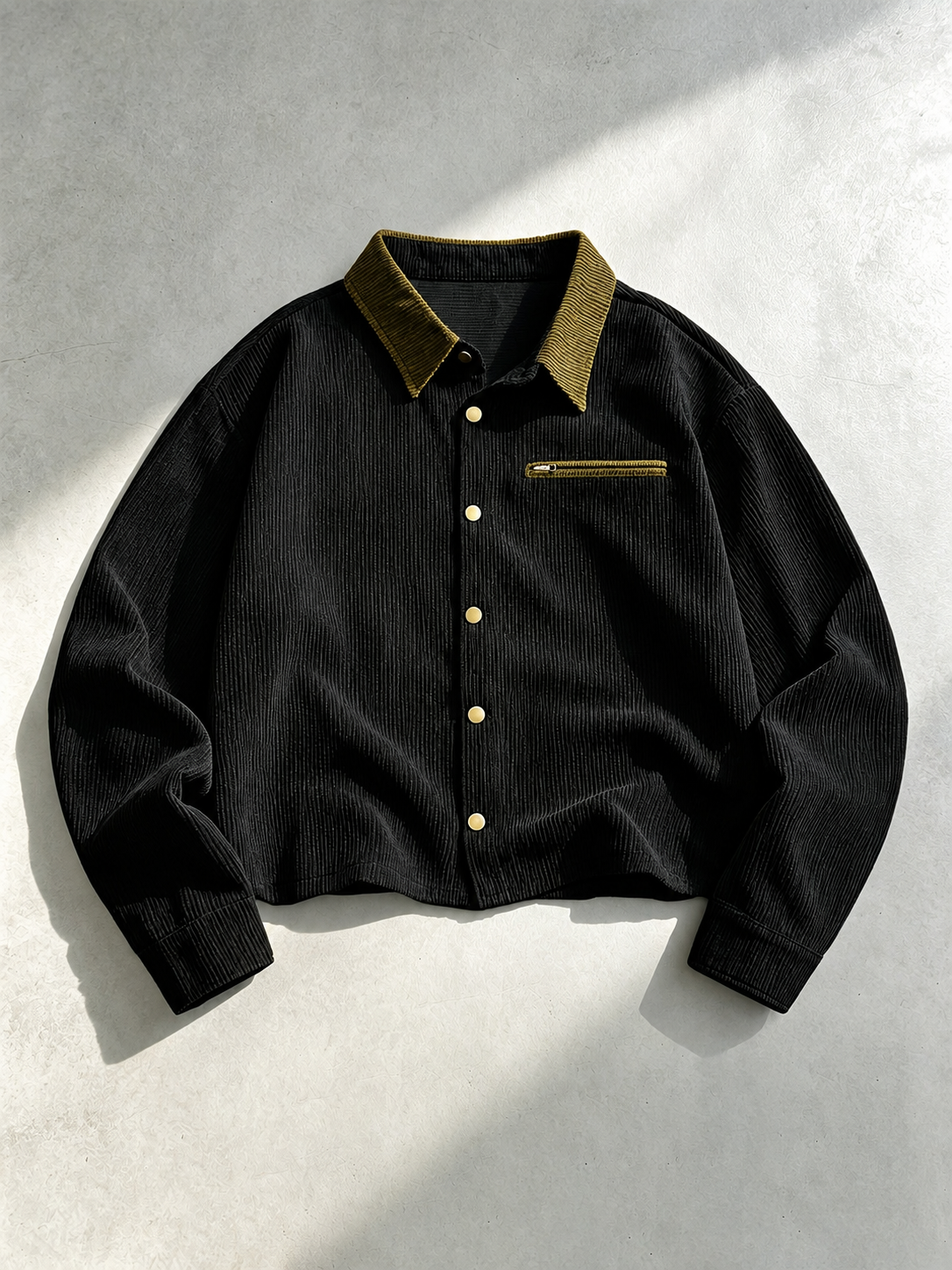 Men's corduroy shirt jacket shown from the front with its button closure.