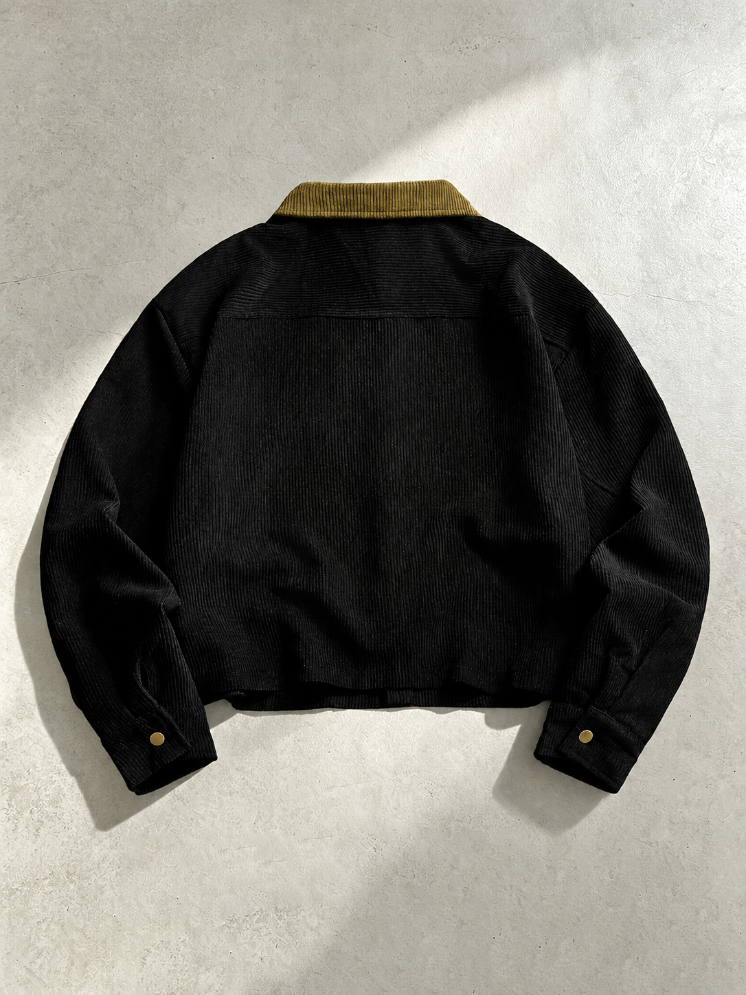 Close-up view of the textured corduroy fabric on a men's shirt jacket.