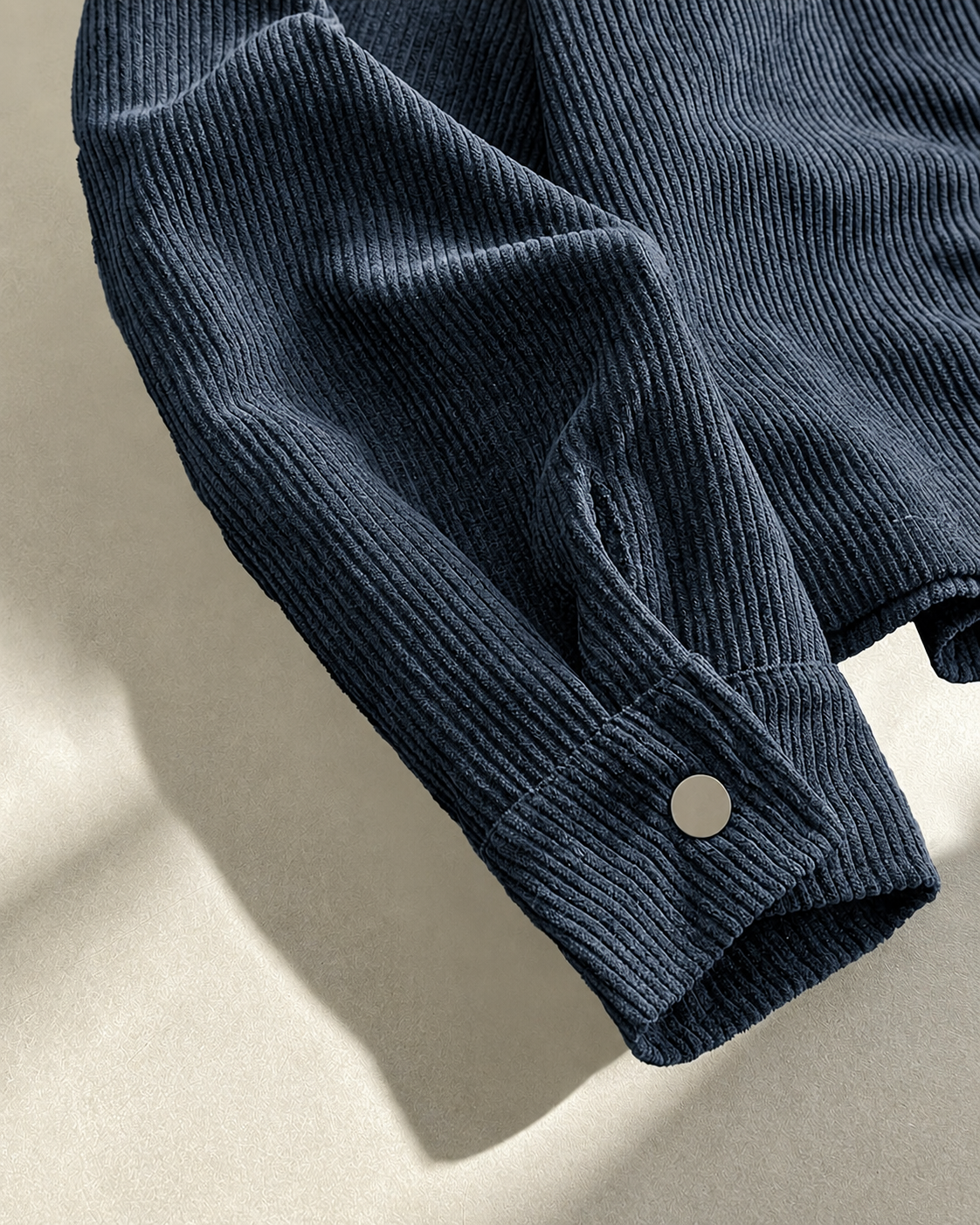 Full view of a men's corduroy shirt jacket for casual seasonal styling.